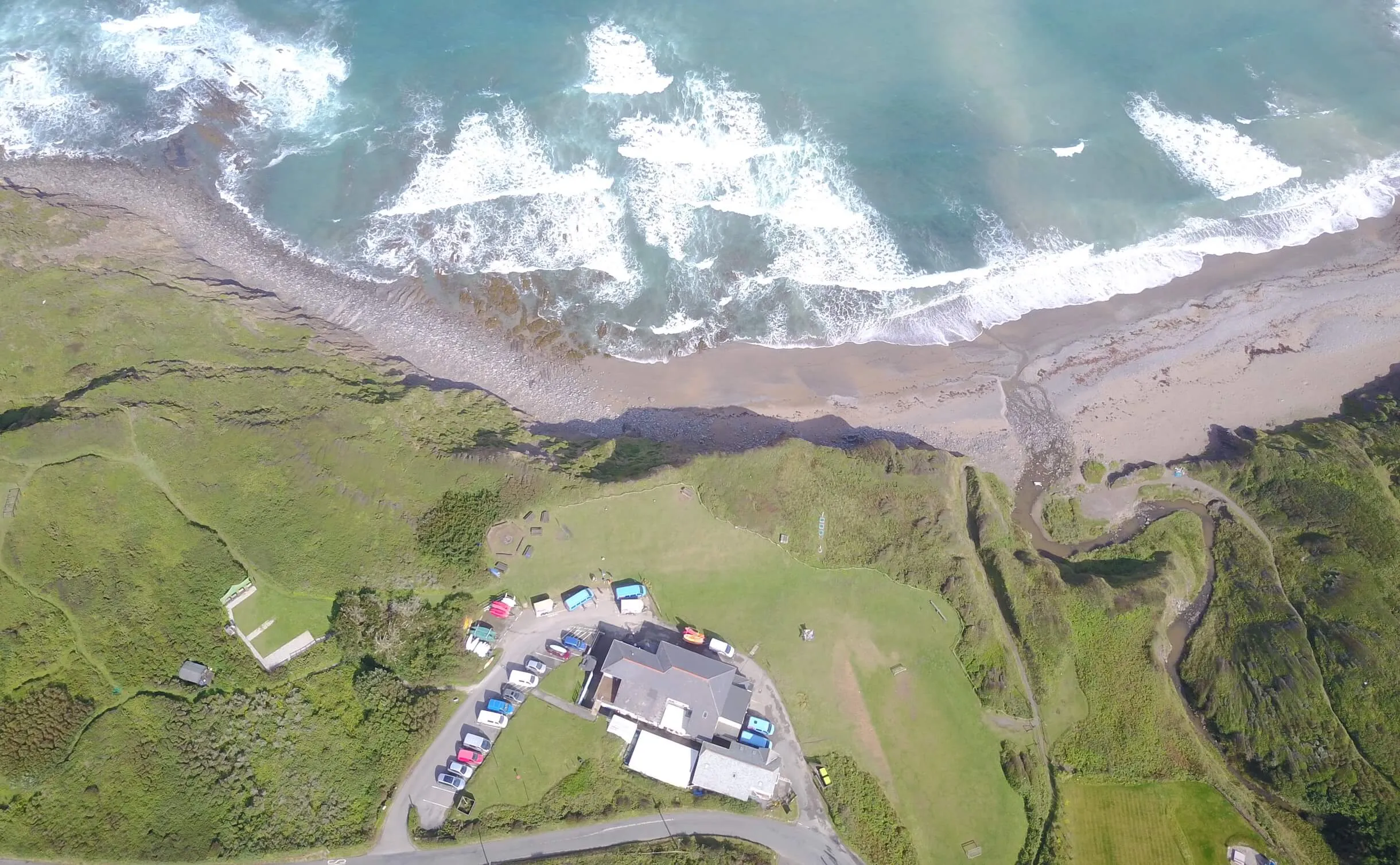 OA Surf Club accommodation views from above showing the sea and cliff